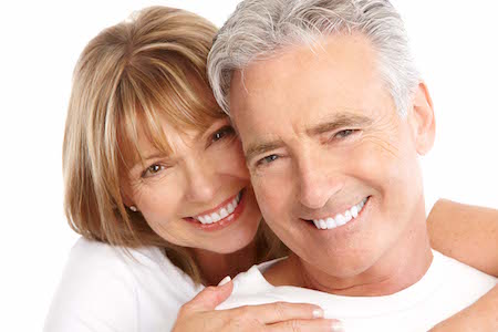 Older couple who have taken some years off from professional teeth whitening. 